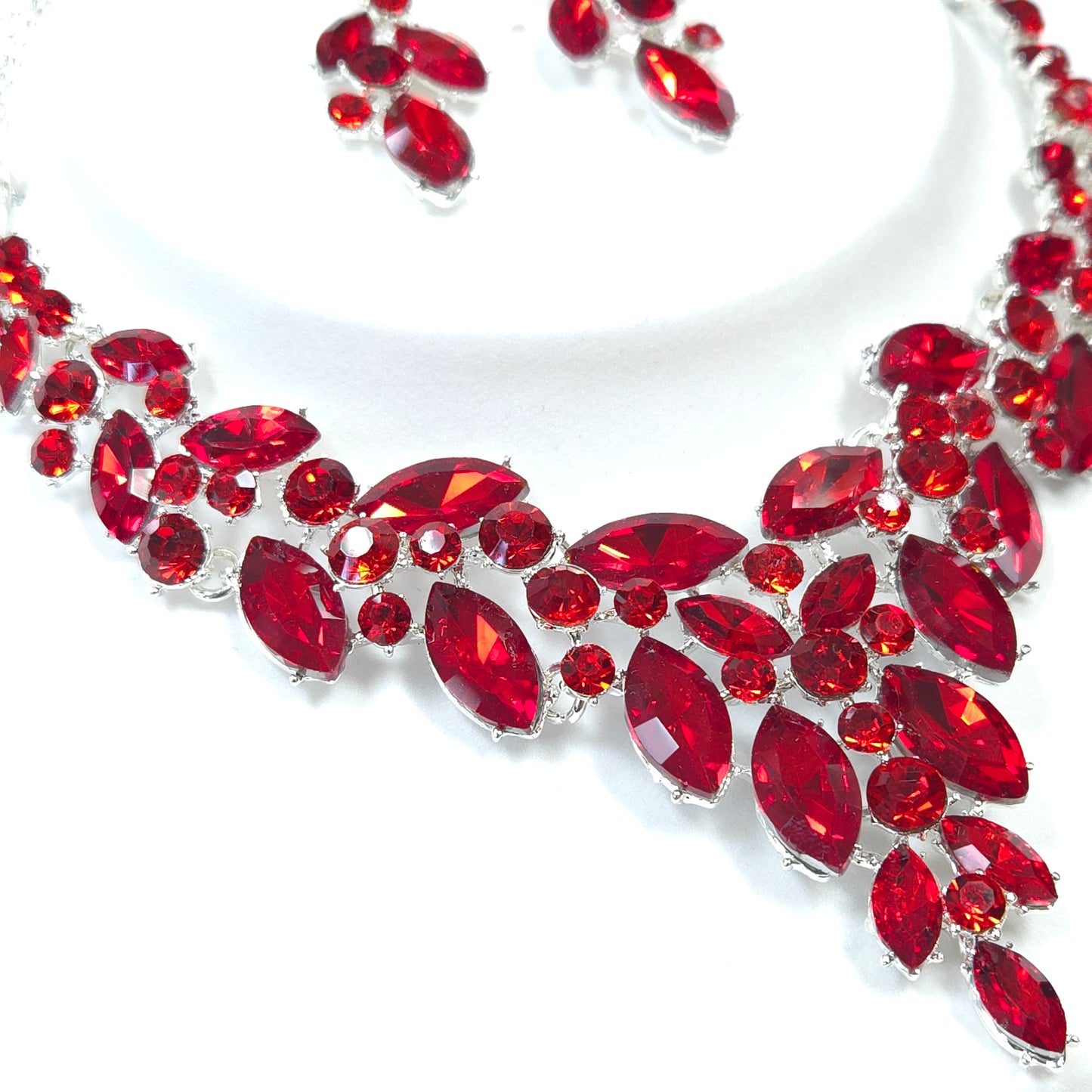 Red gemstone necklace on a white background