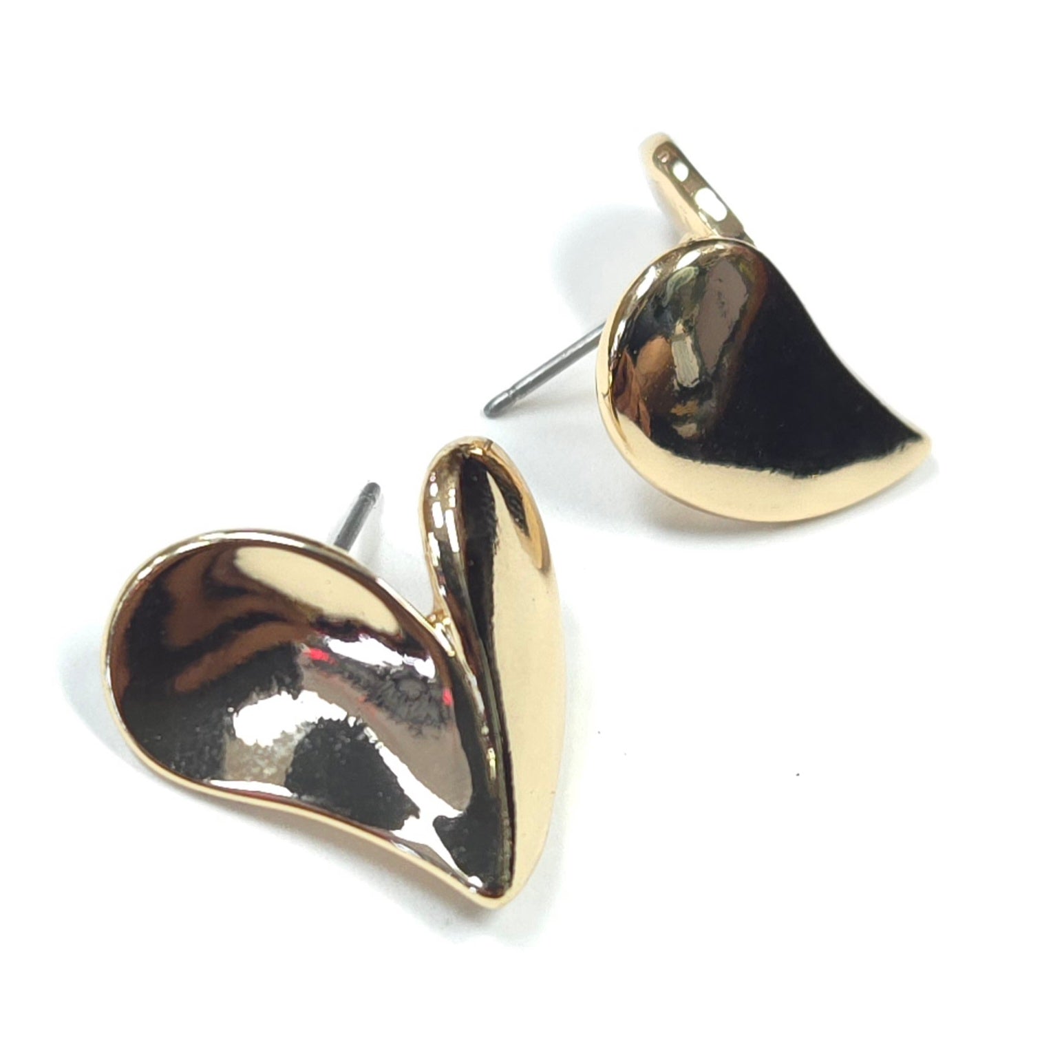 Gold heart-shaped earrings on a white background