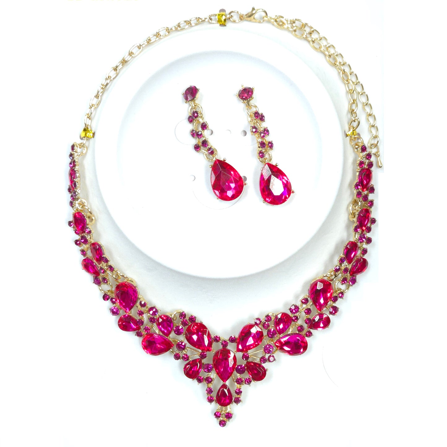 Jewelry set with pink teardrop-shaped earrings and necklace on a white background