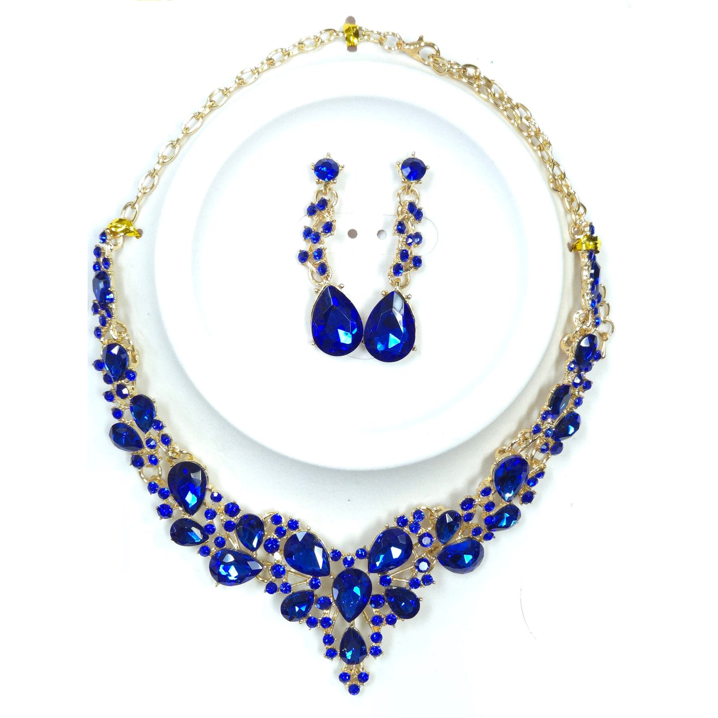 Jewelry set with blue teardrop-shaped stones on a white background