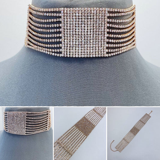 A choker necklace with a lobster claw closure, adorned with rhinestones and displayed on a mannequin neck.
