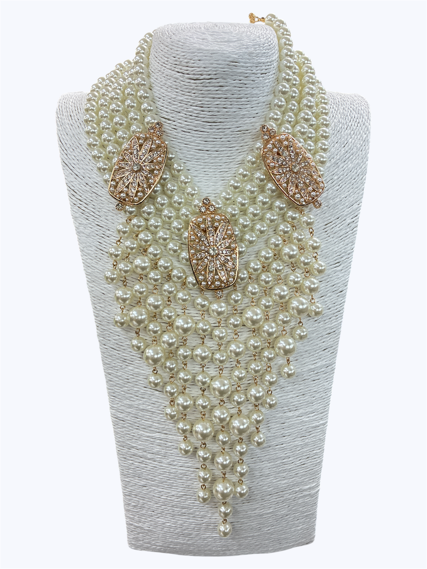 Layered faux pearl statement necklace featuring cascading pearl fringe strands with rhinestone geometric accents and dramatic bib styling.