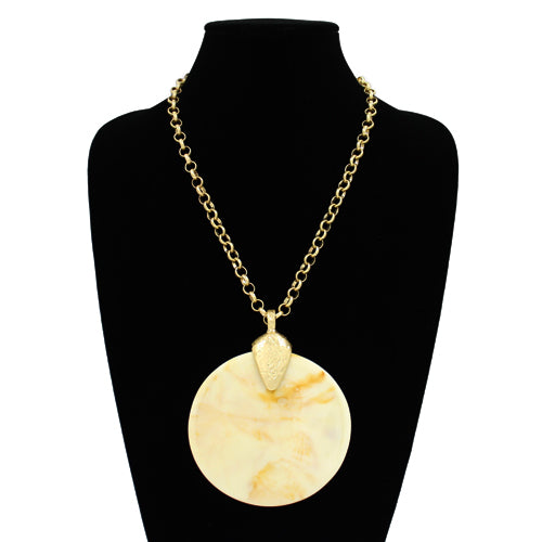 Oversized round resin pendant necklace with a textured disc charm on a link chain.