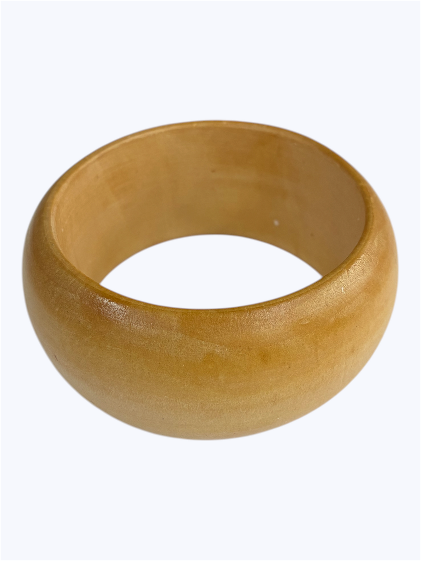 Natural wood rounded bangle bracelet with a smooth artisan-inspired minimalist design