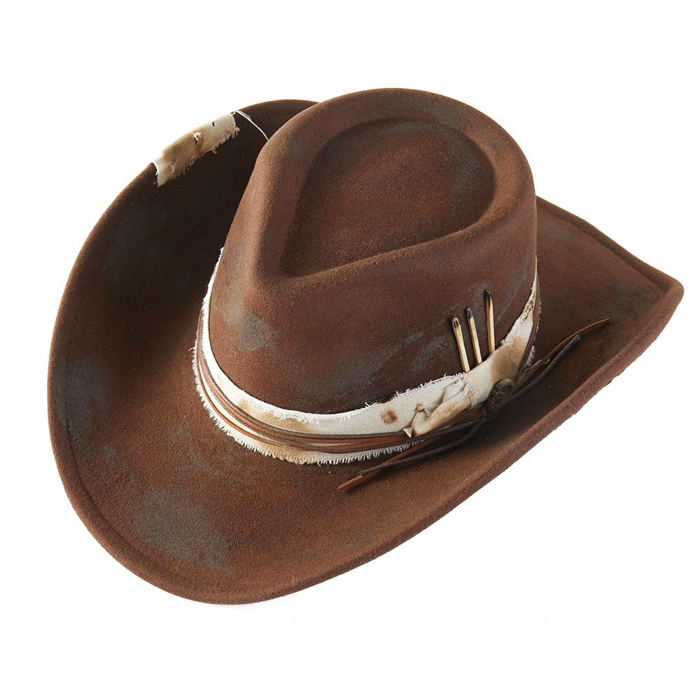 Brown cowboy hat with feather accents on a white background