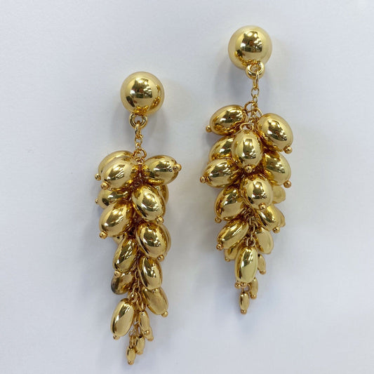 A gold earrings on a white background