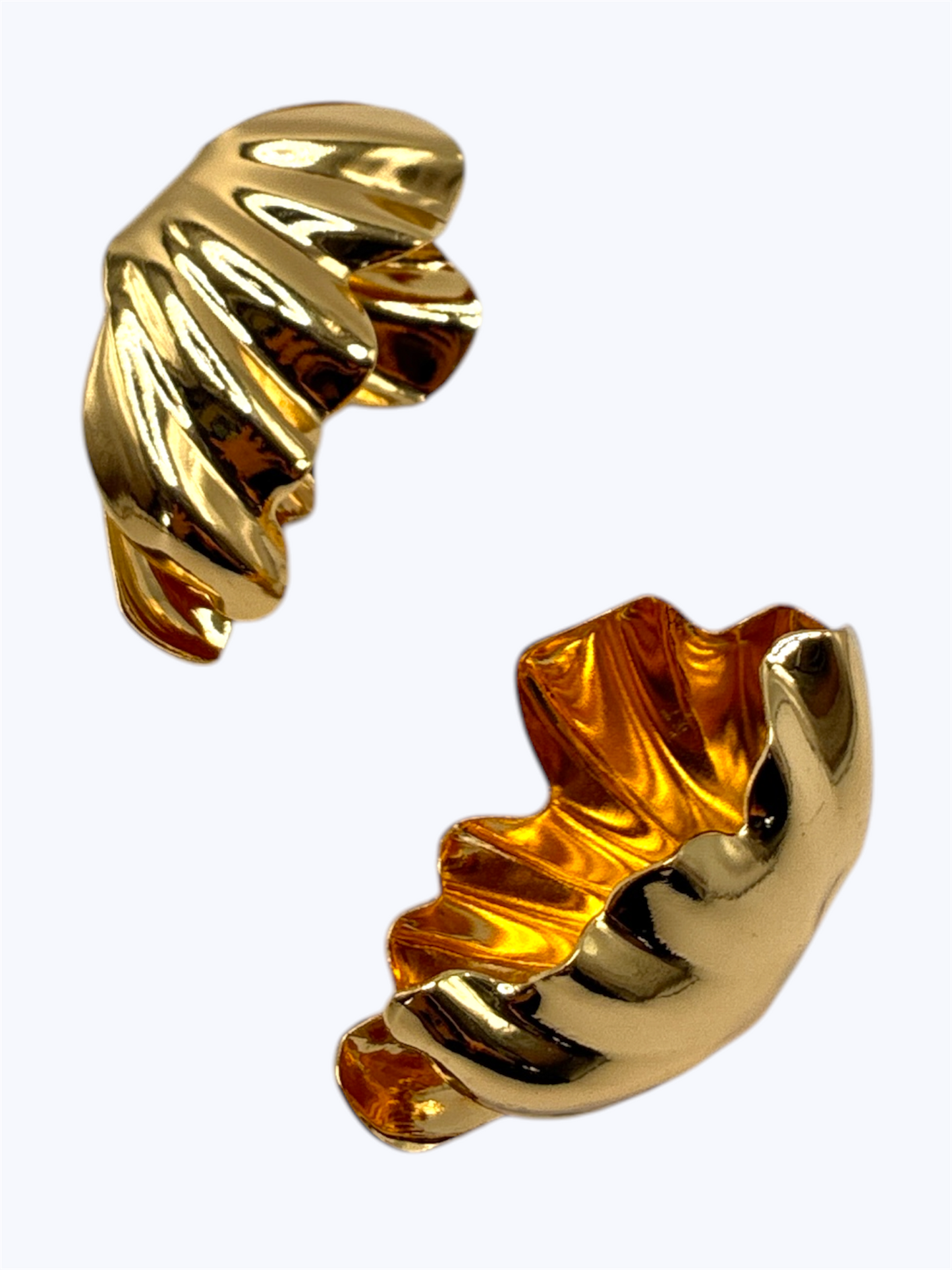 Pair of gold hoop earrings on a white background