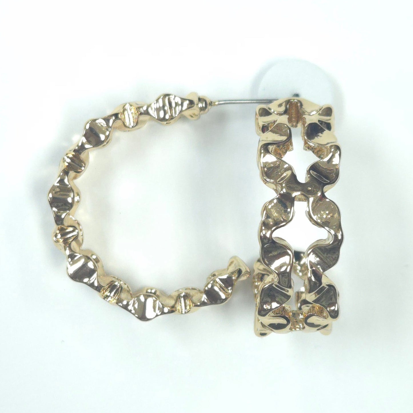 Gold hoop earrings with star designs on a white background