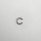 Metallic letter 'C' charm on a white background