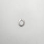 Silver pendant shaped like the letter 'O' on a light gray background