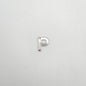 Silver letter 'P' charm on a light gray background