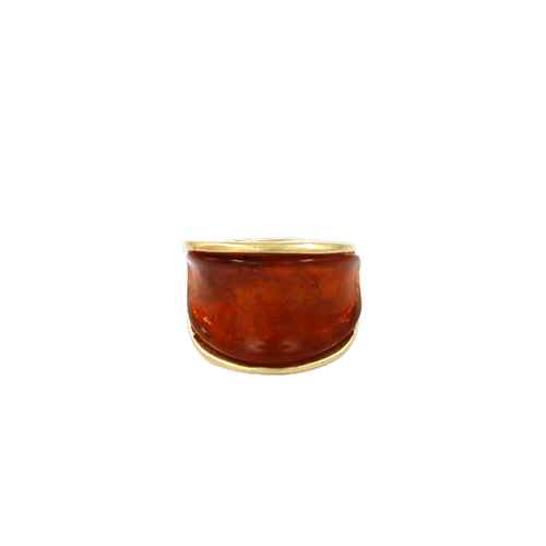 Wide resin band ring with glossy marbled finish and sleek metallic trim in a modern minimalist design.