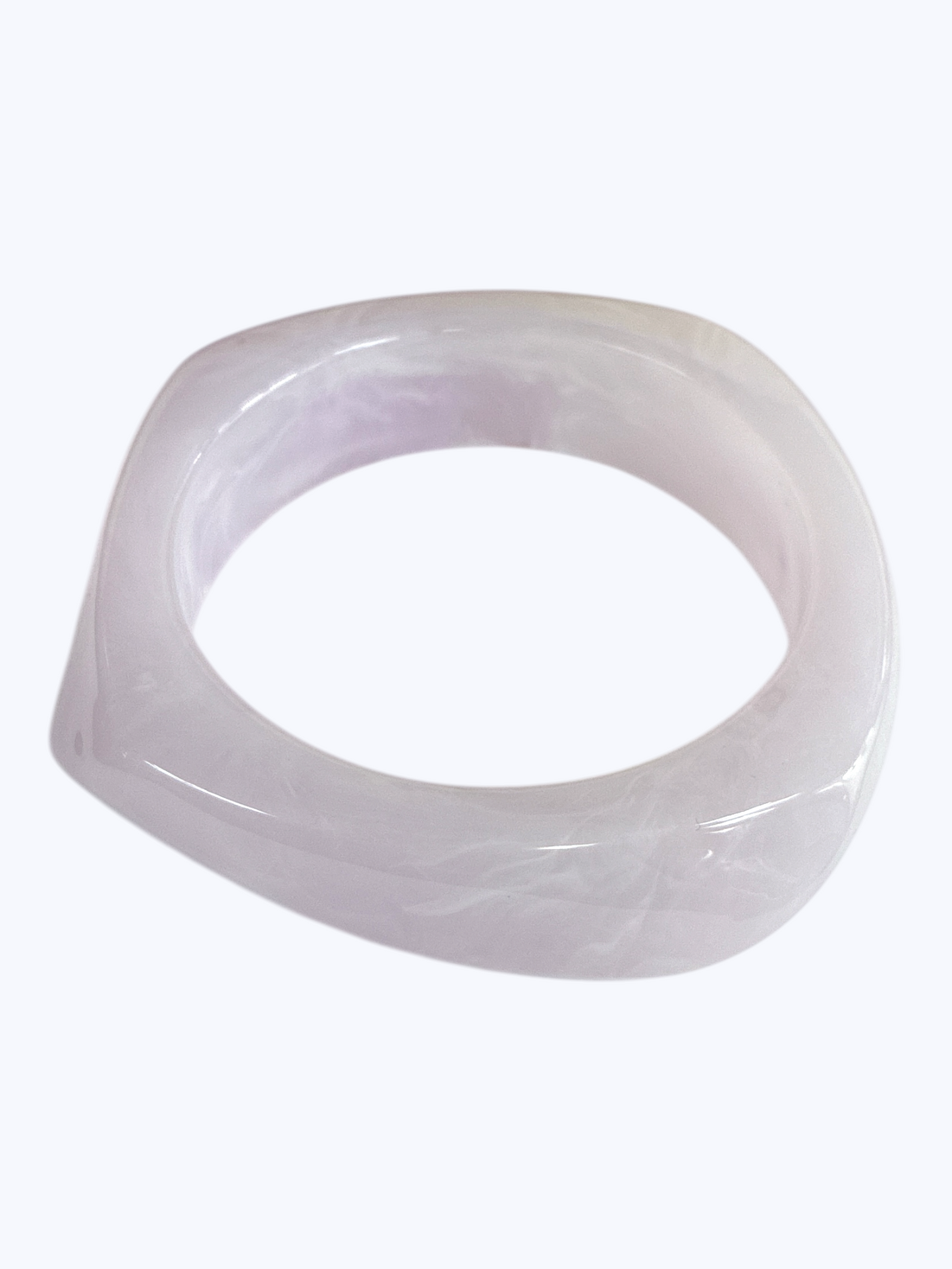 Minimalist marbled resin bangle bracelet with rounded square shape and polished glossy finish.