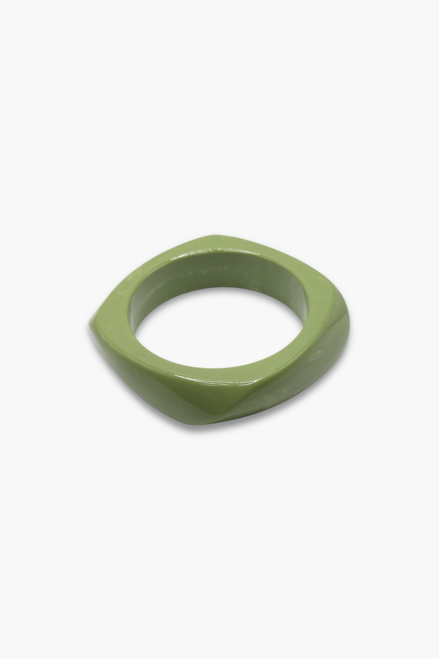 Minimalist marbled resin bangle bracelet with rounded square shape and polished glossy finish.
