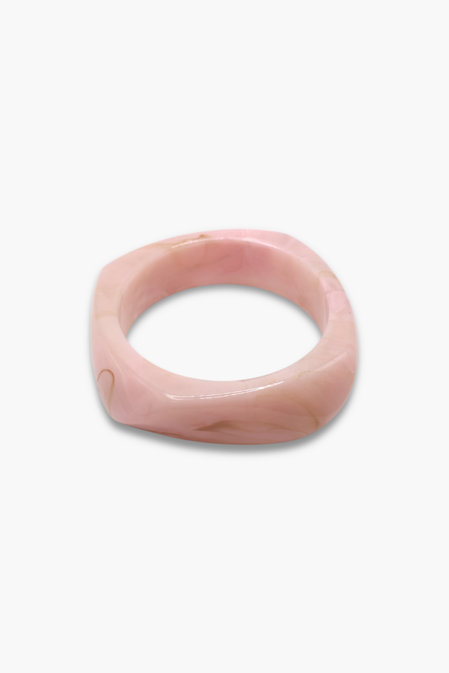 Minimalist marbled resin bangle bracelet with rounded square shape and polished glossy finish.