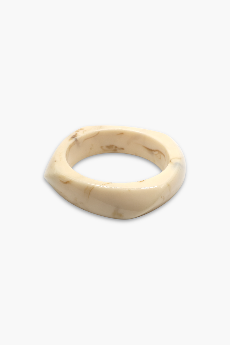 Minimalist marbled resin bangle bracelet with rounded square shape and polished glossy finish.