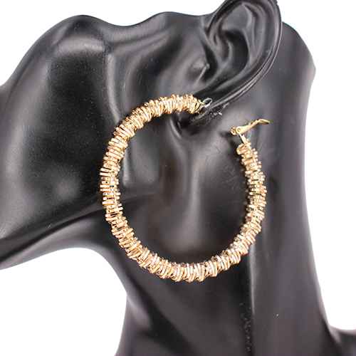 Large textured hoop earrings featuring sparkling crystal accents and a dimensional layered design.
