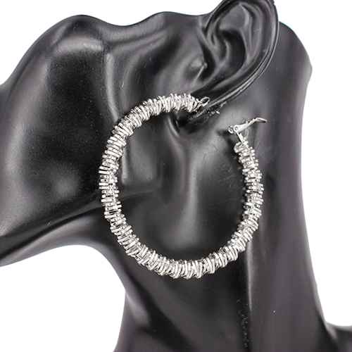Large textured hoop earrings featuring sparkling crystal accents and a dimensional layered design.