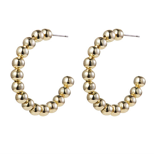 Gold hoop earrings with bead detailing on a white background