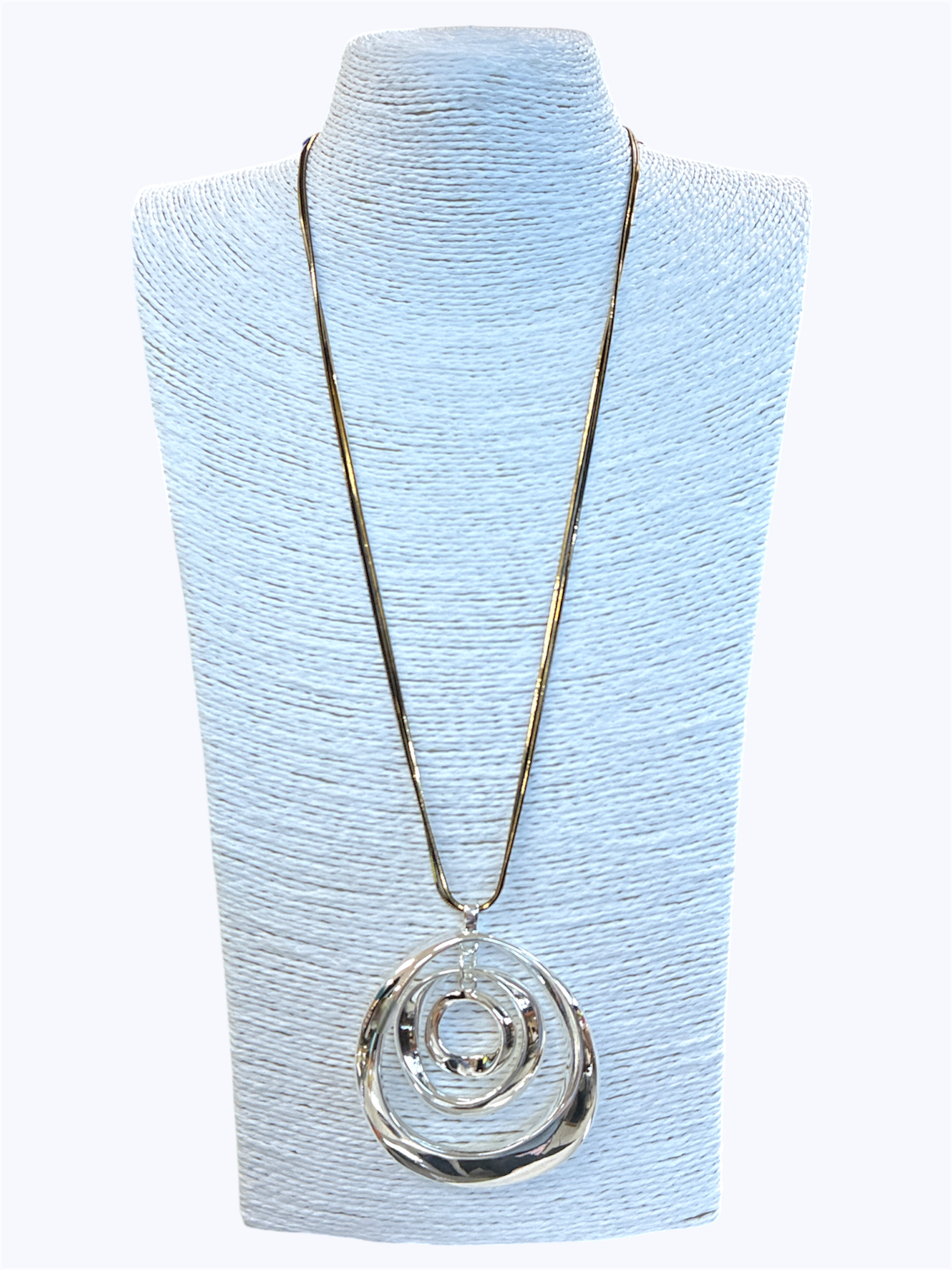 Necklace with a silver pendant on a light blue mannequin bust
