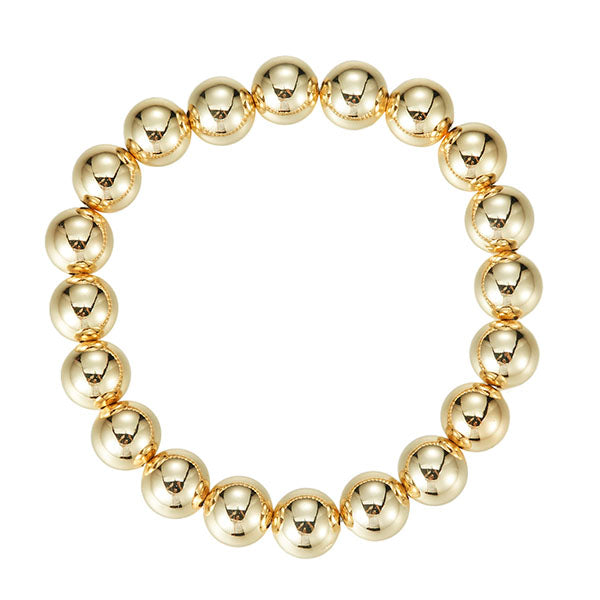 Gold beaded bracelet on a white background