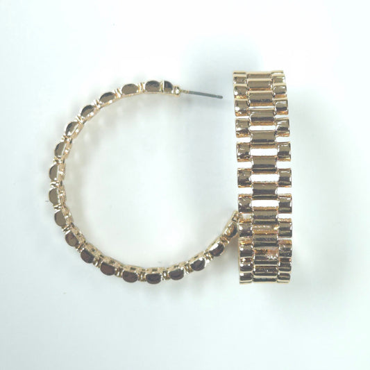 Gold hoop earrings with embedded stones on a white background