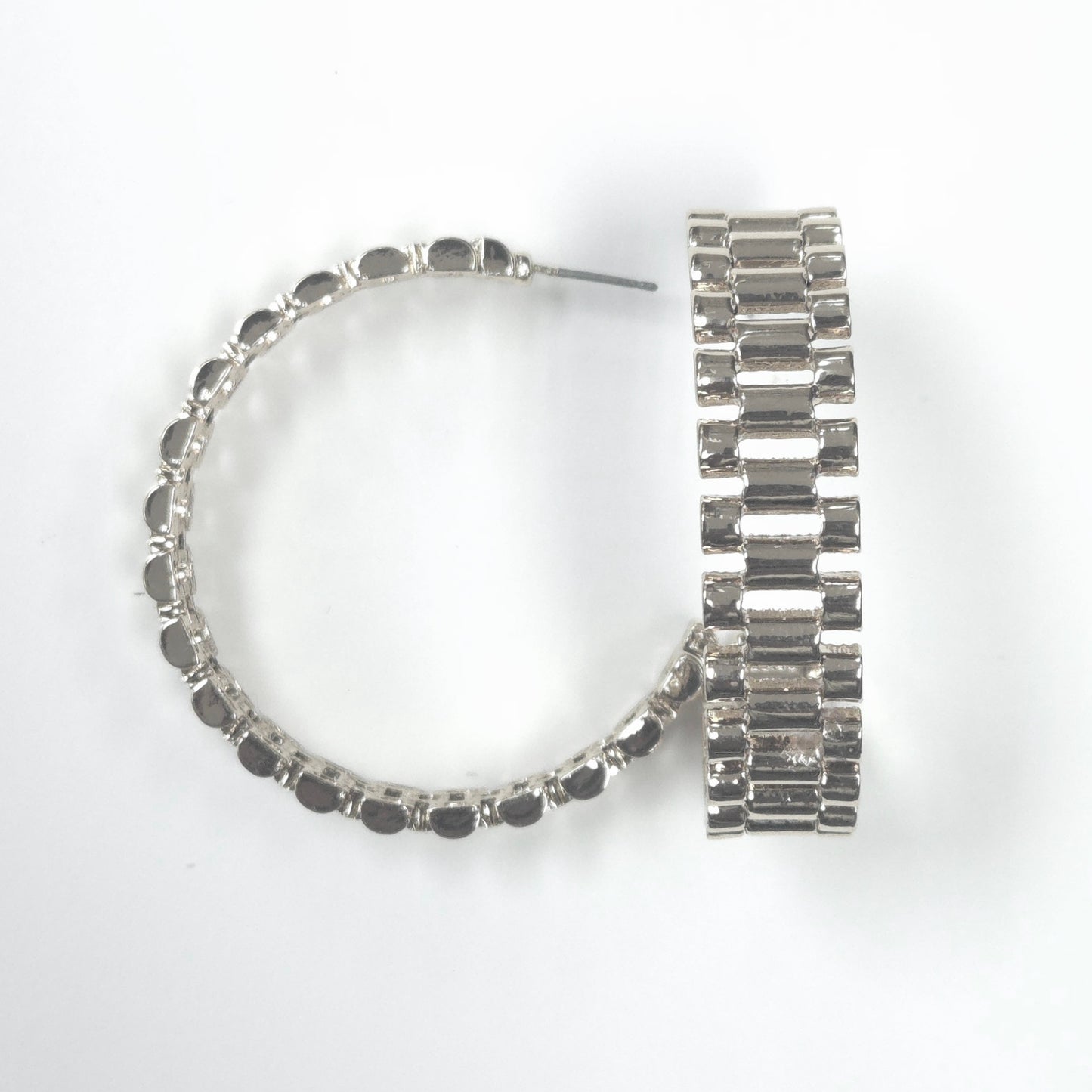 Silver hoop earrings with black beads on a white background