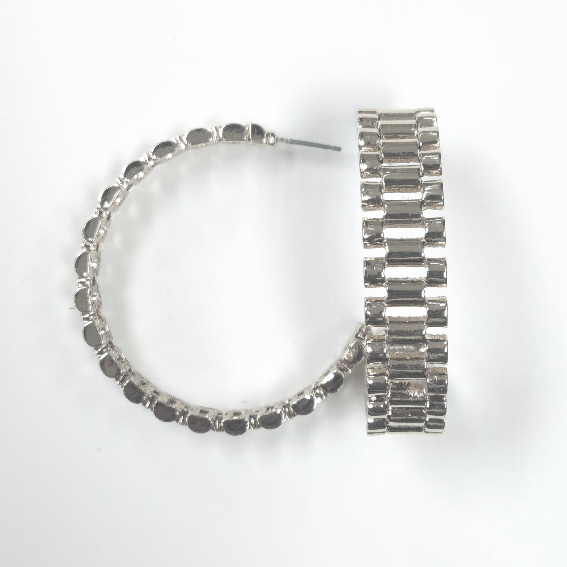 Silver hoop earrings with black beads on a white background