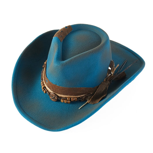 Blue cowboy hat with decorative band and feather on a white background