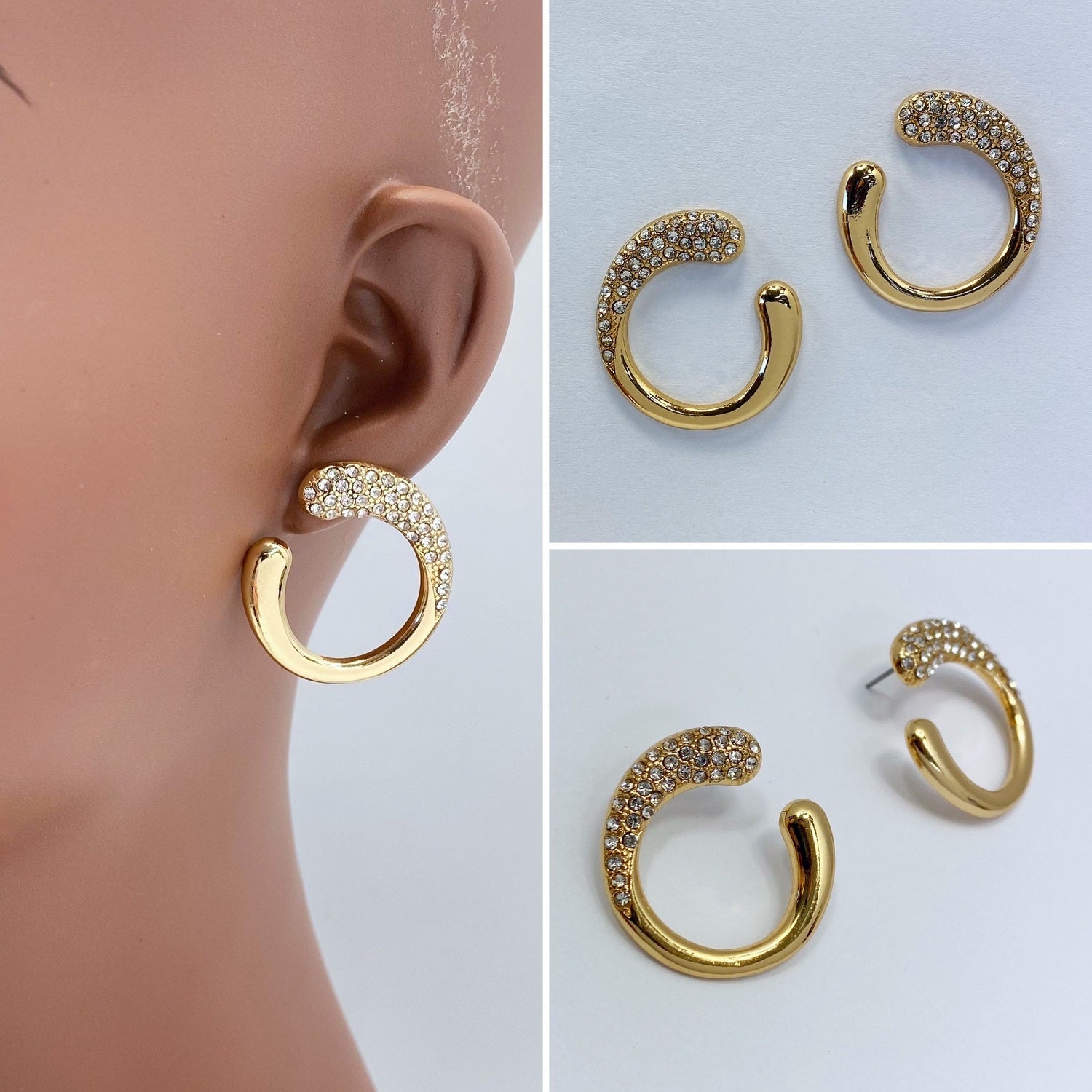 A gold earrings on a white background