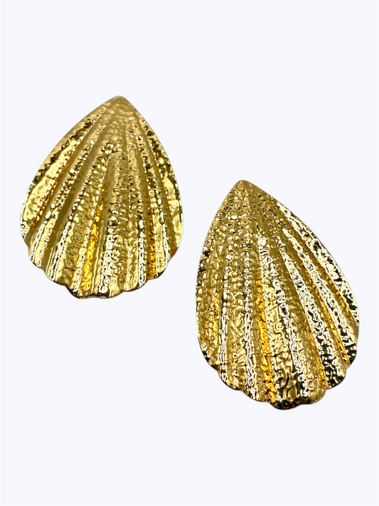 Textured teardrop stud earrings with ribbed shell-inspired sculpted metal design.