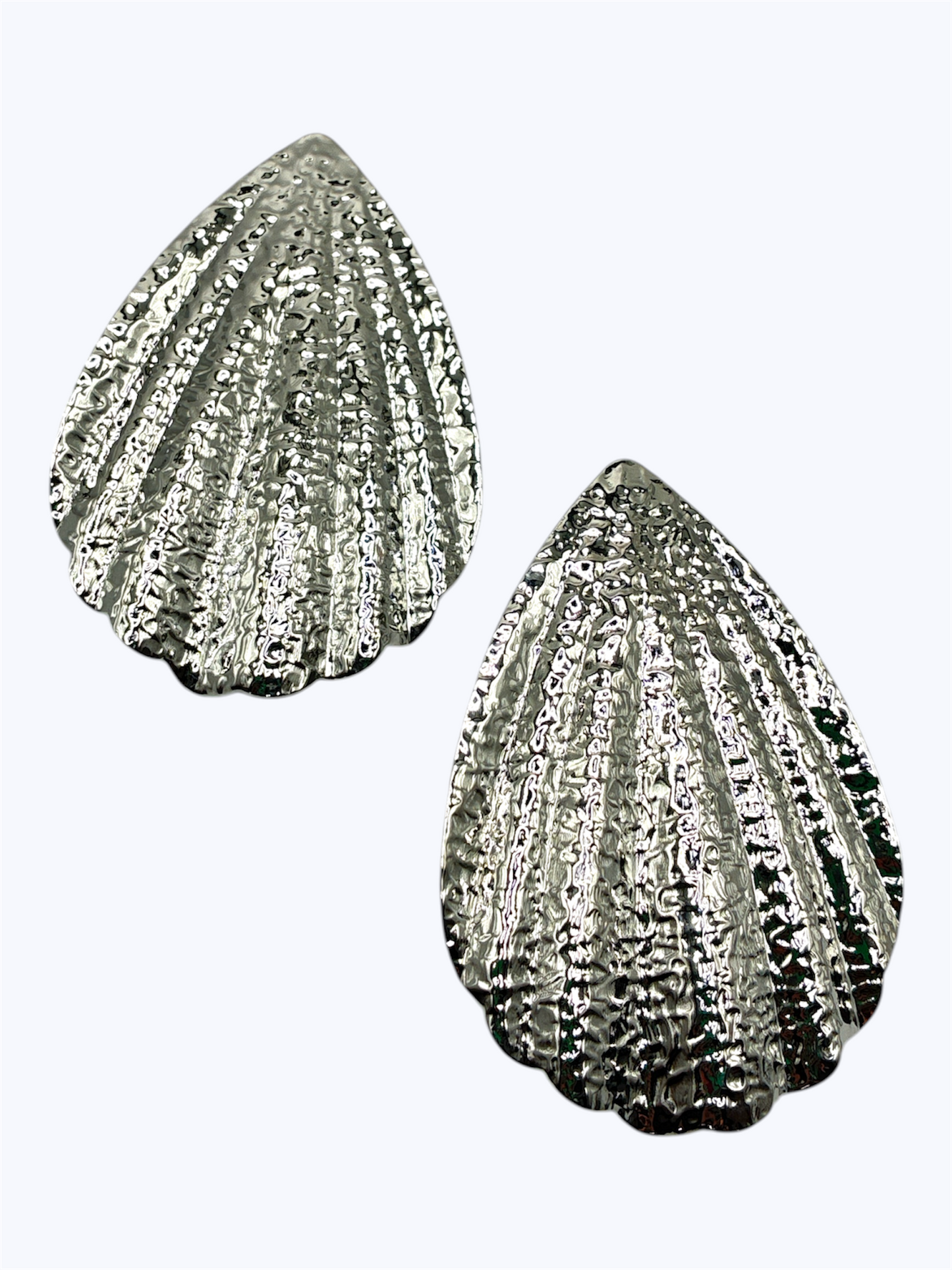 Textured teardrop stud earrings with ribbed shell-inspired sculpted metal design.
