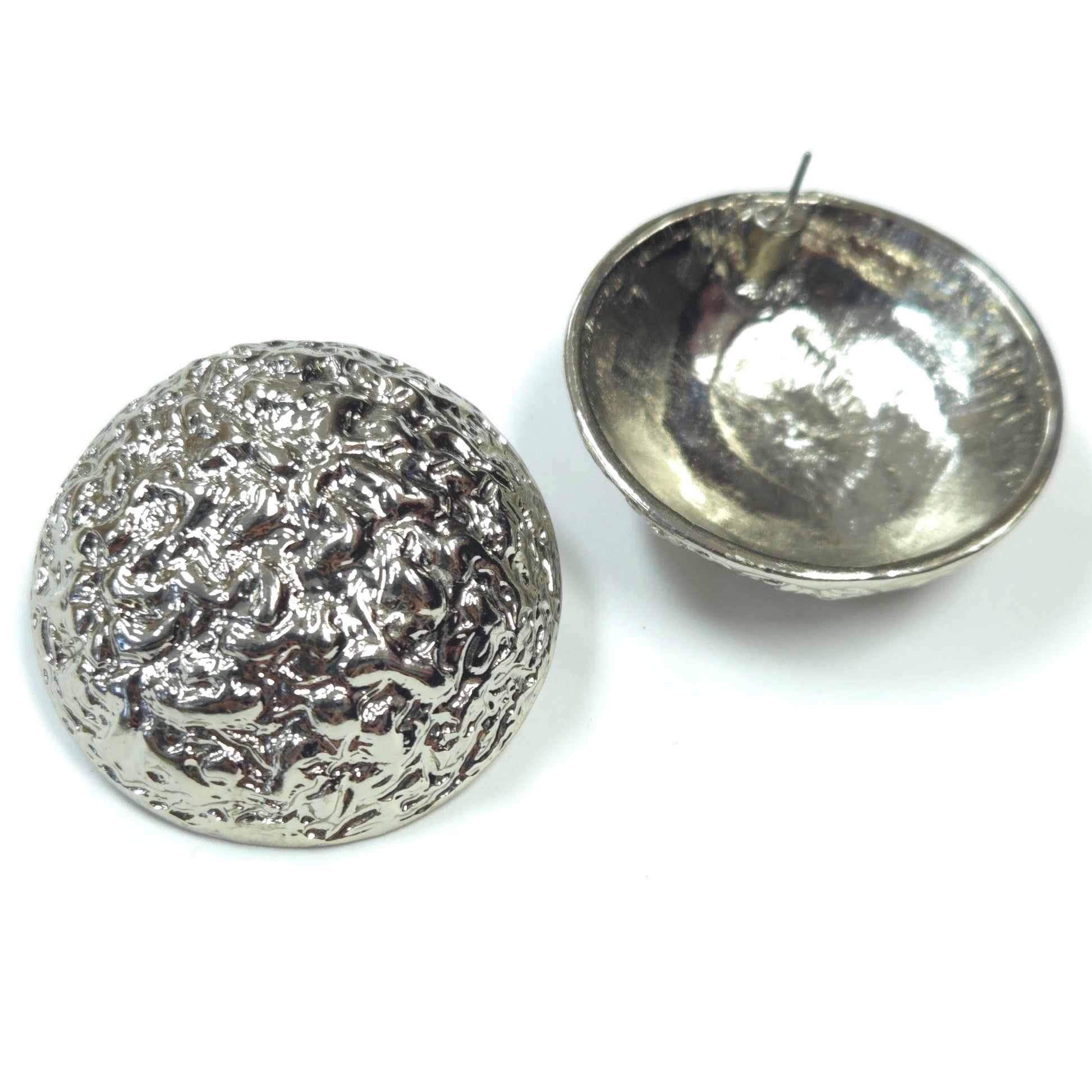 Two silver textured containers on a white background