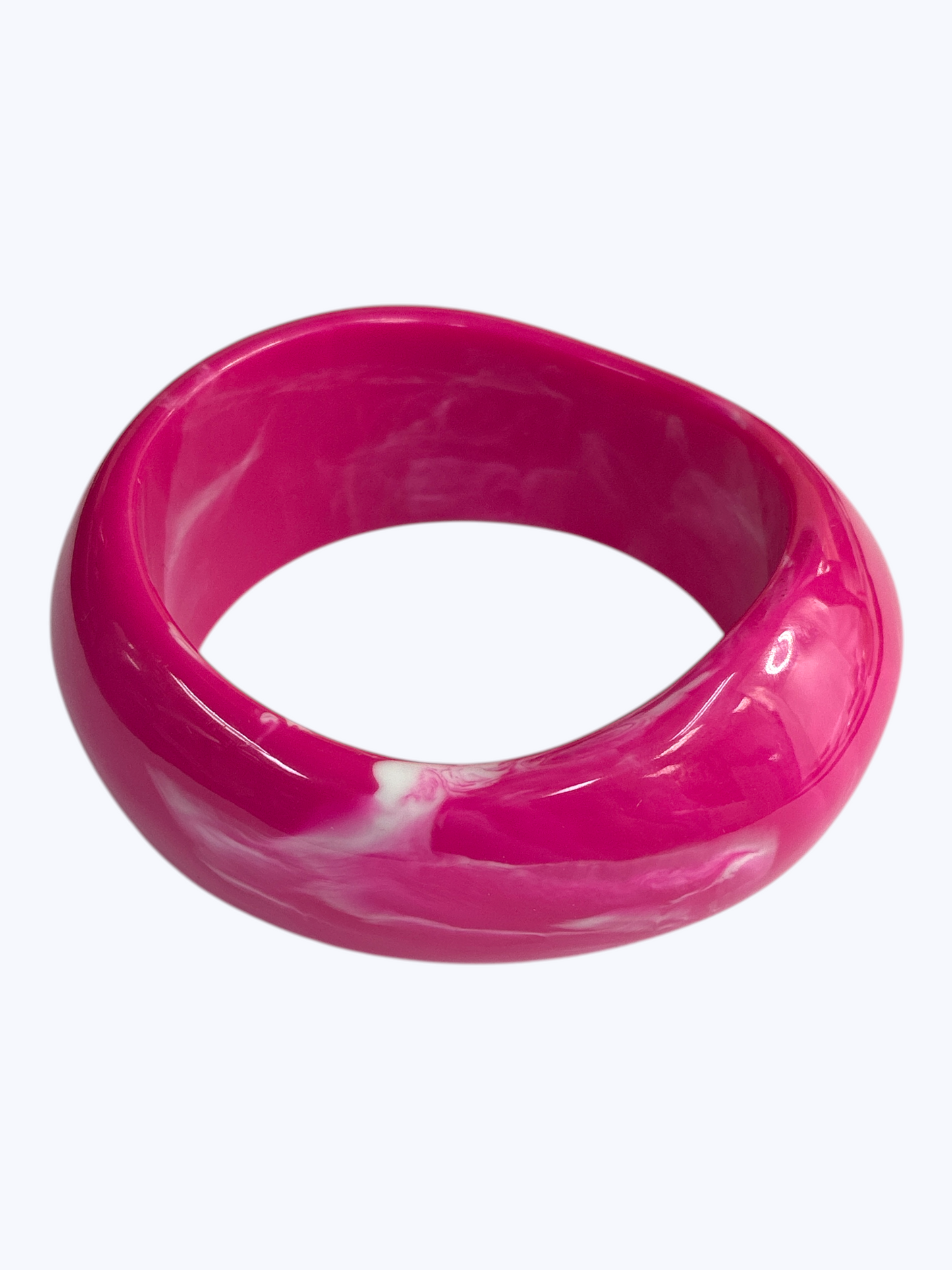 Glossy marbled resin bangle bracelet with chunky rounded silhouette and polished finish.