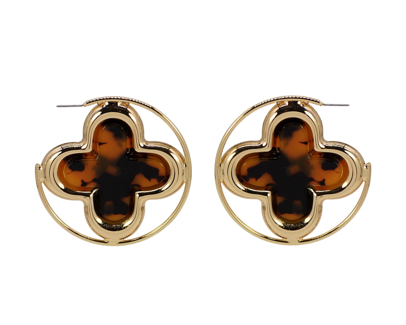 Pair of gold earrings with tortoiseshell clover-like centers on a white background