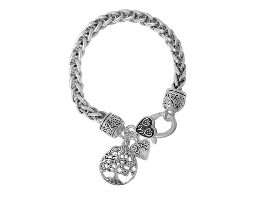 Silver-tone chain bracelet featuring tree of life charm, heart accents, decorative toggle clasp, and vintage-inspired detailing.