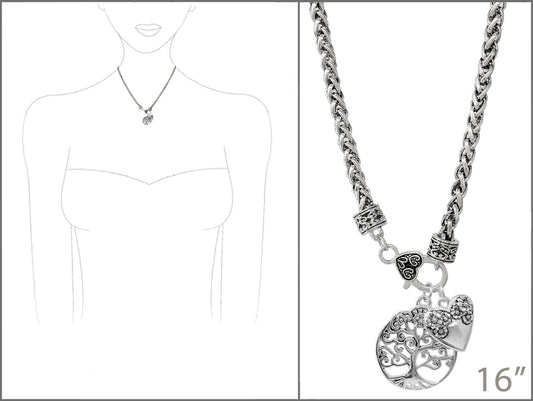 Silver necklace with tree of life pendant on a white background