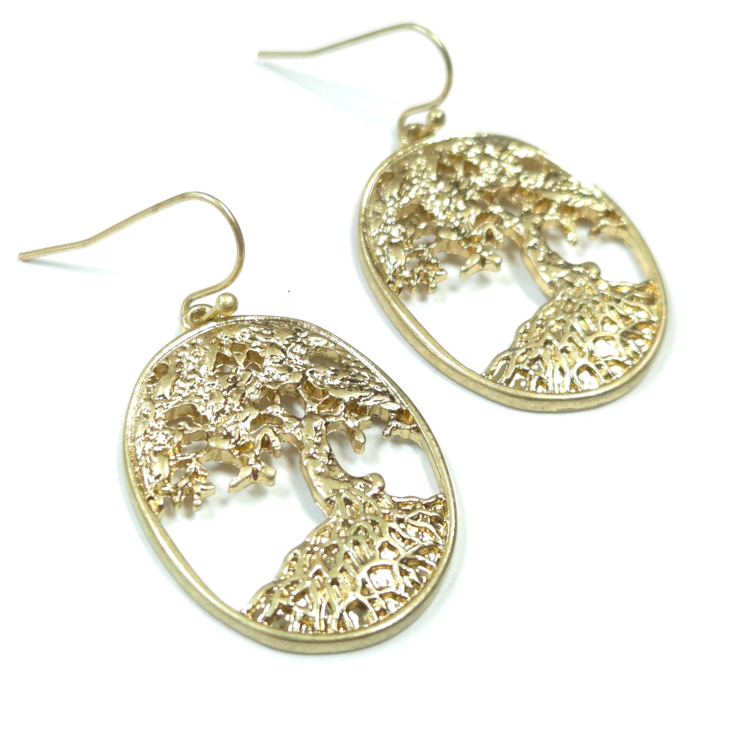 Gold tree-shaped earrings on a white background