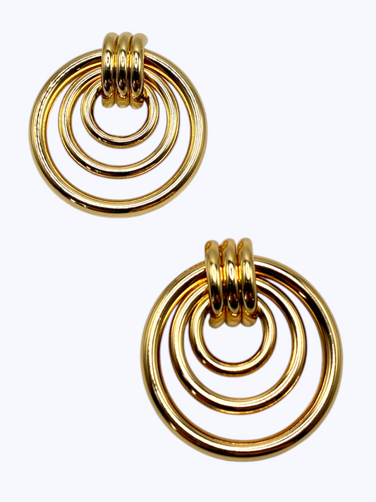 Pair of gold hoop earrings on a white background