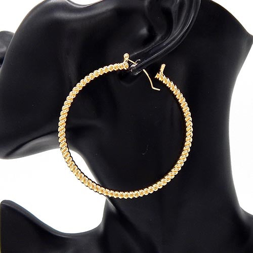 Large textured hoop earrings with twisted rope design on a mannequin ear display