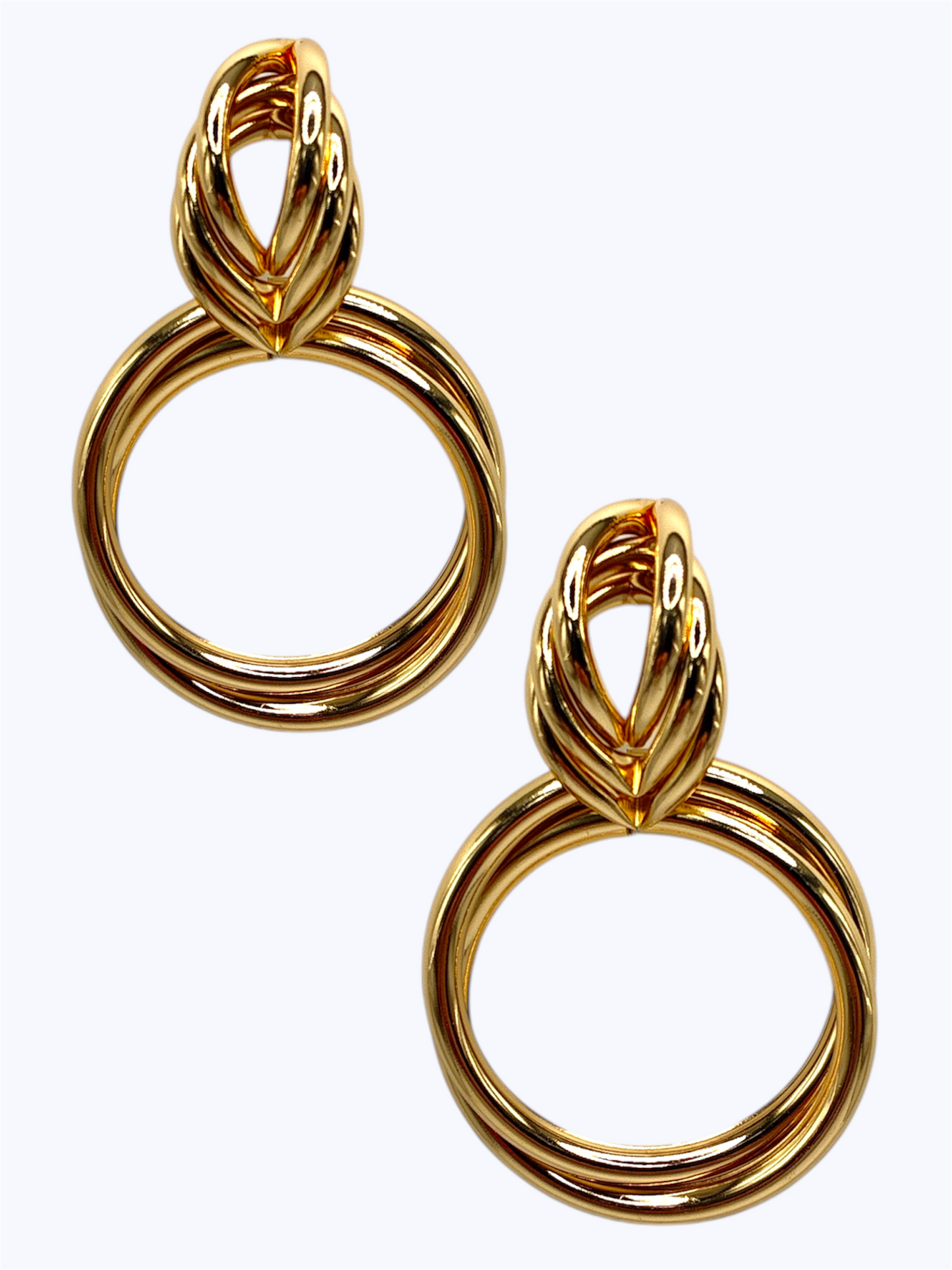Pair of gold hoop earrings on a white background