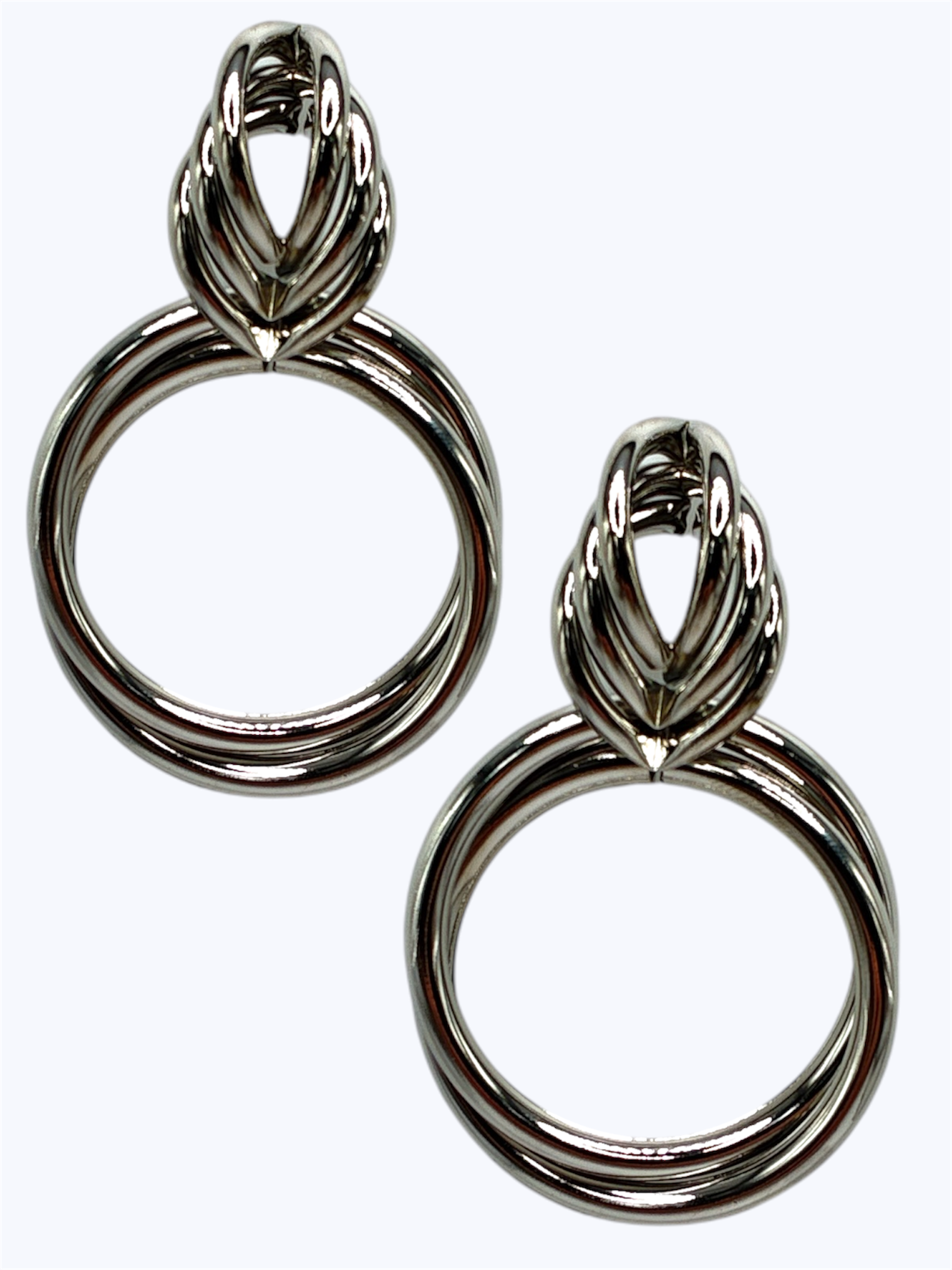 Pair of silver hoop earrings on a white background
