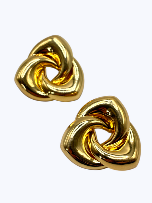 Gold-tone twisted knot statement earrings with polished sculptural design for chic modern boutique fashion accessories collection
