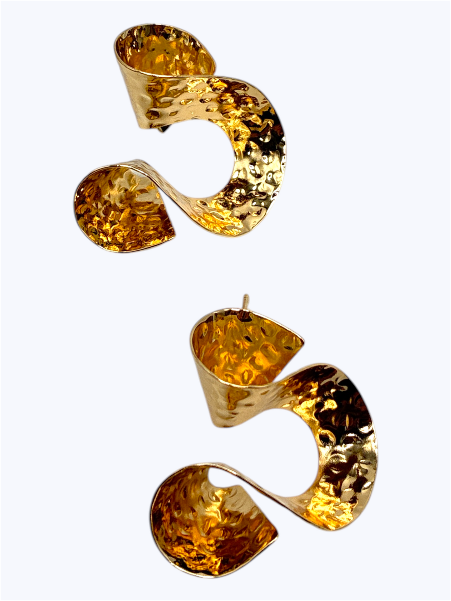 Gold earrings with a textured design on a white background