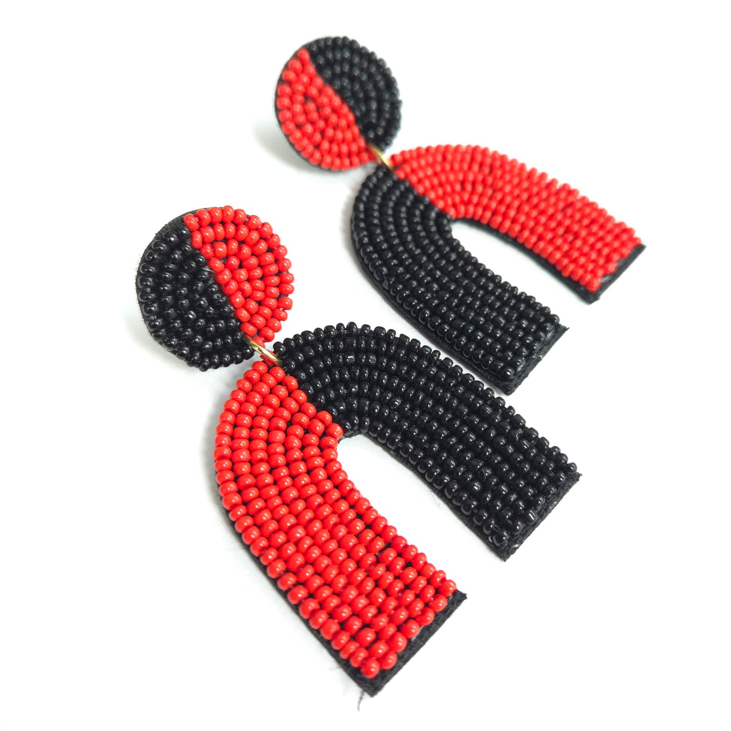 Black and red beaded earrings on a white background