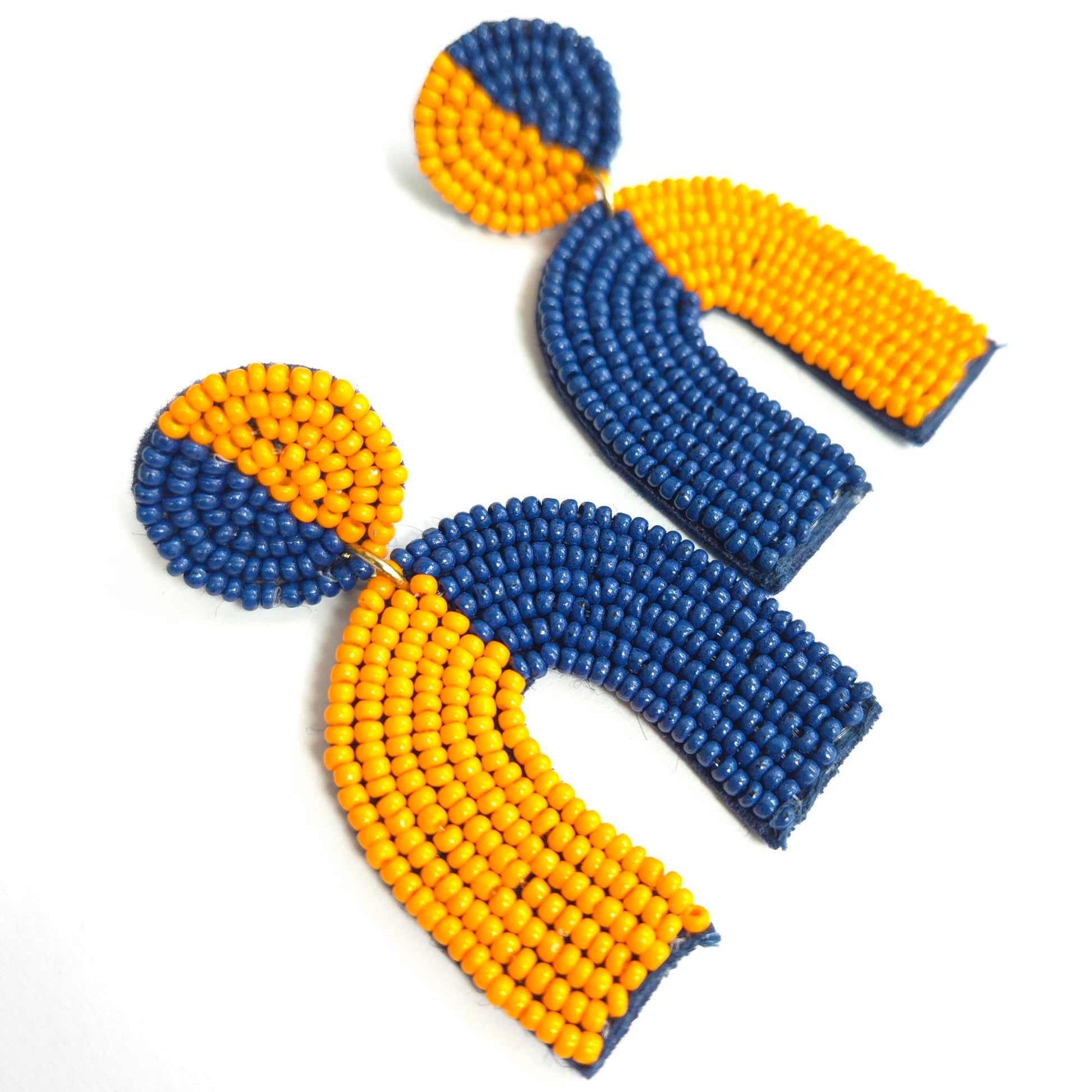 Blue and yellow beaded earrings on a white background