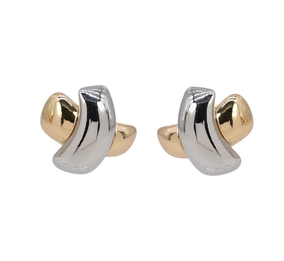 Pair of gold and silver earrings on a white background