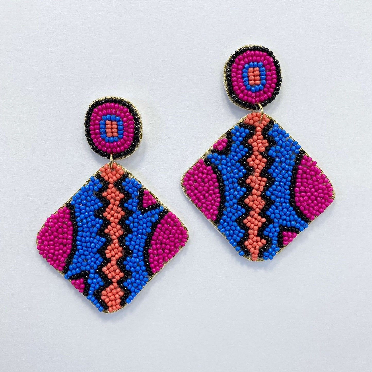 A vibrant earrings on a white background