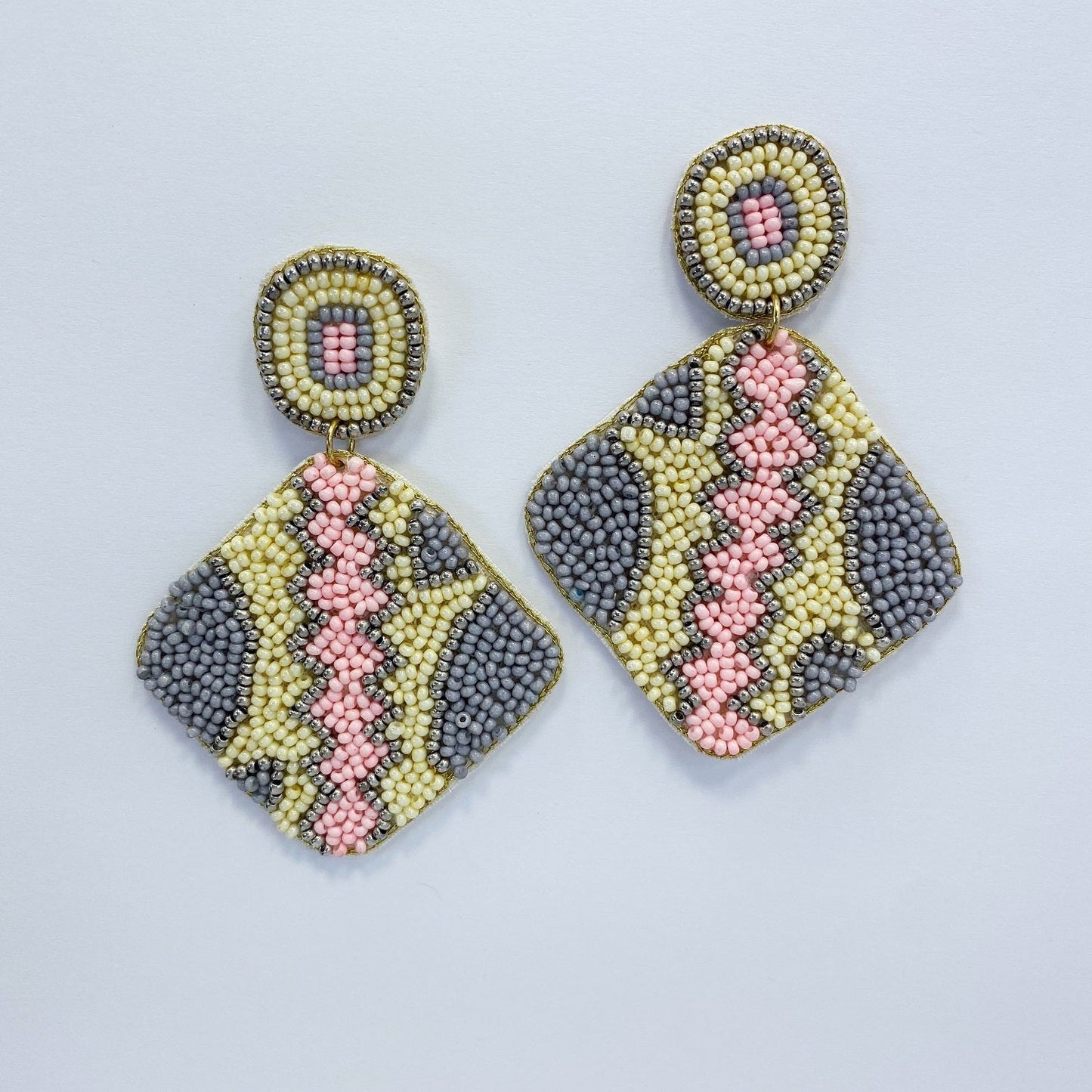 A vibrant earring on a white background