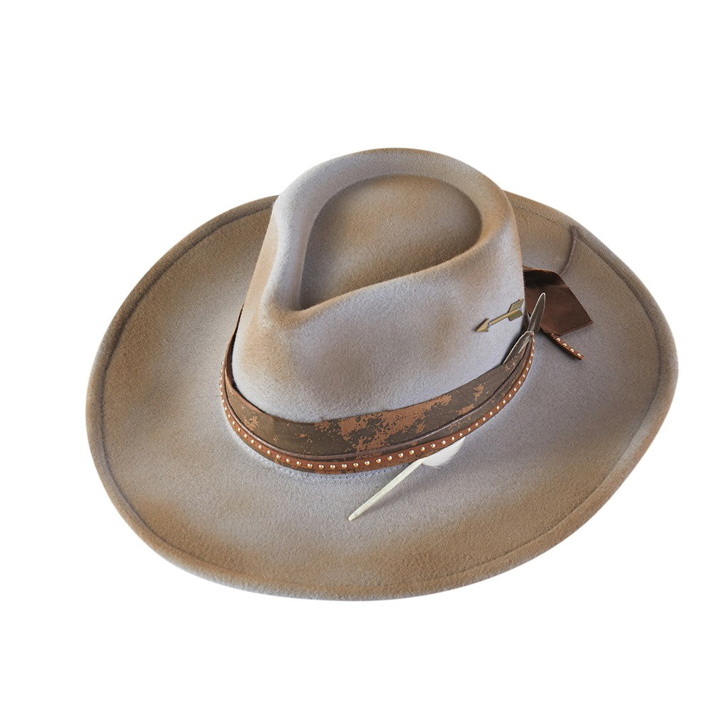 Beige cowboy hat with a band and feather on a white background